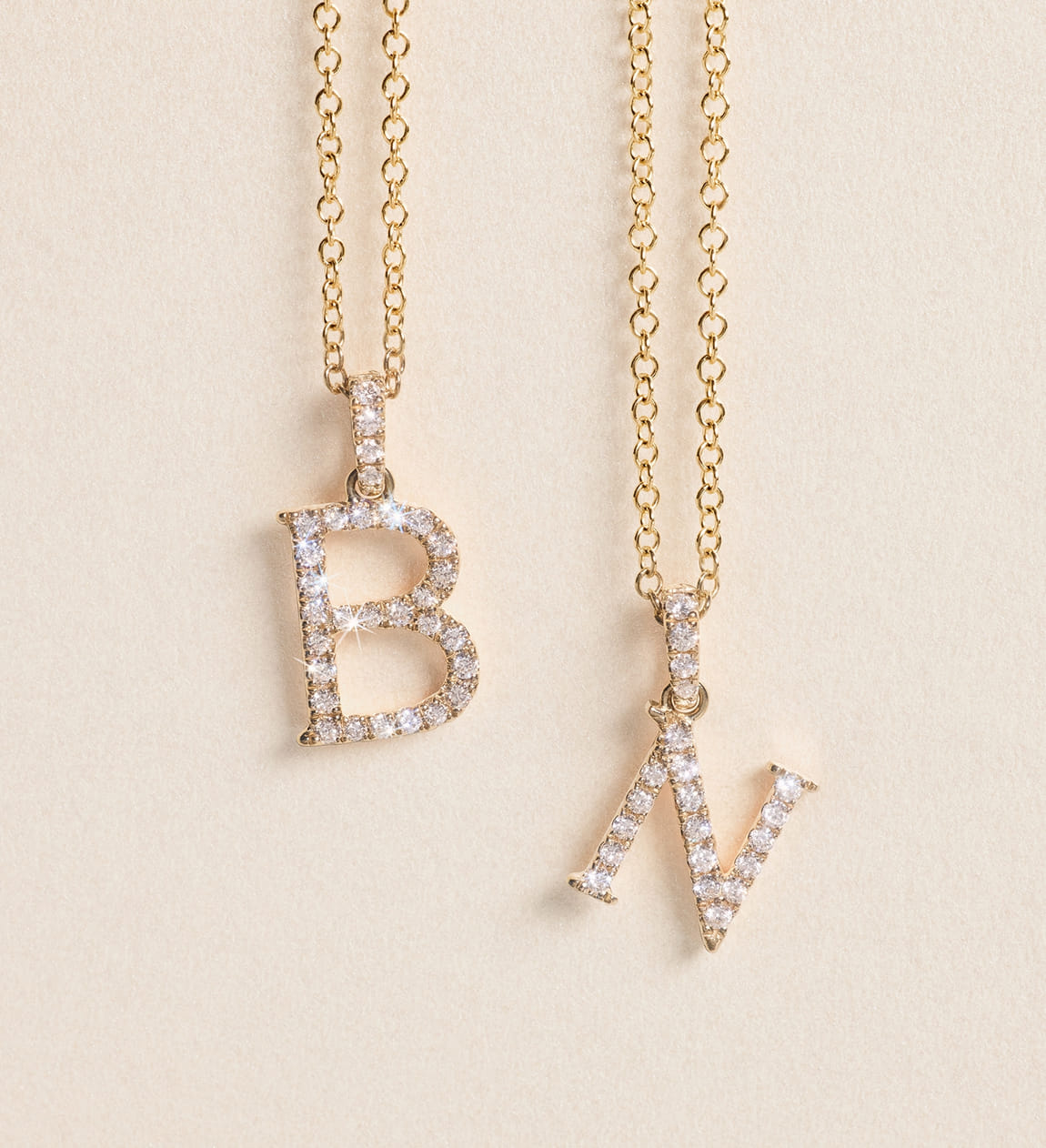 B and N diamond letter charm necklaces in 14k yellow gold